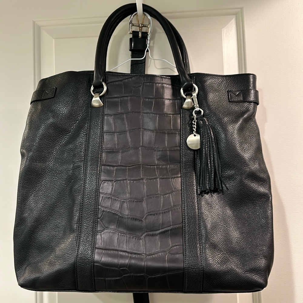 Black leather tote bag with tassel